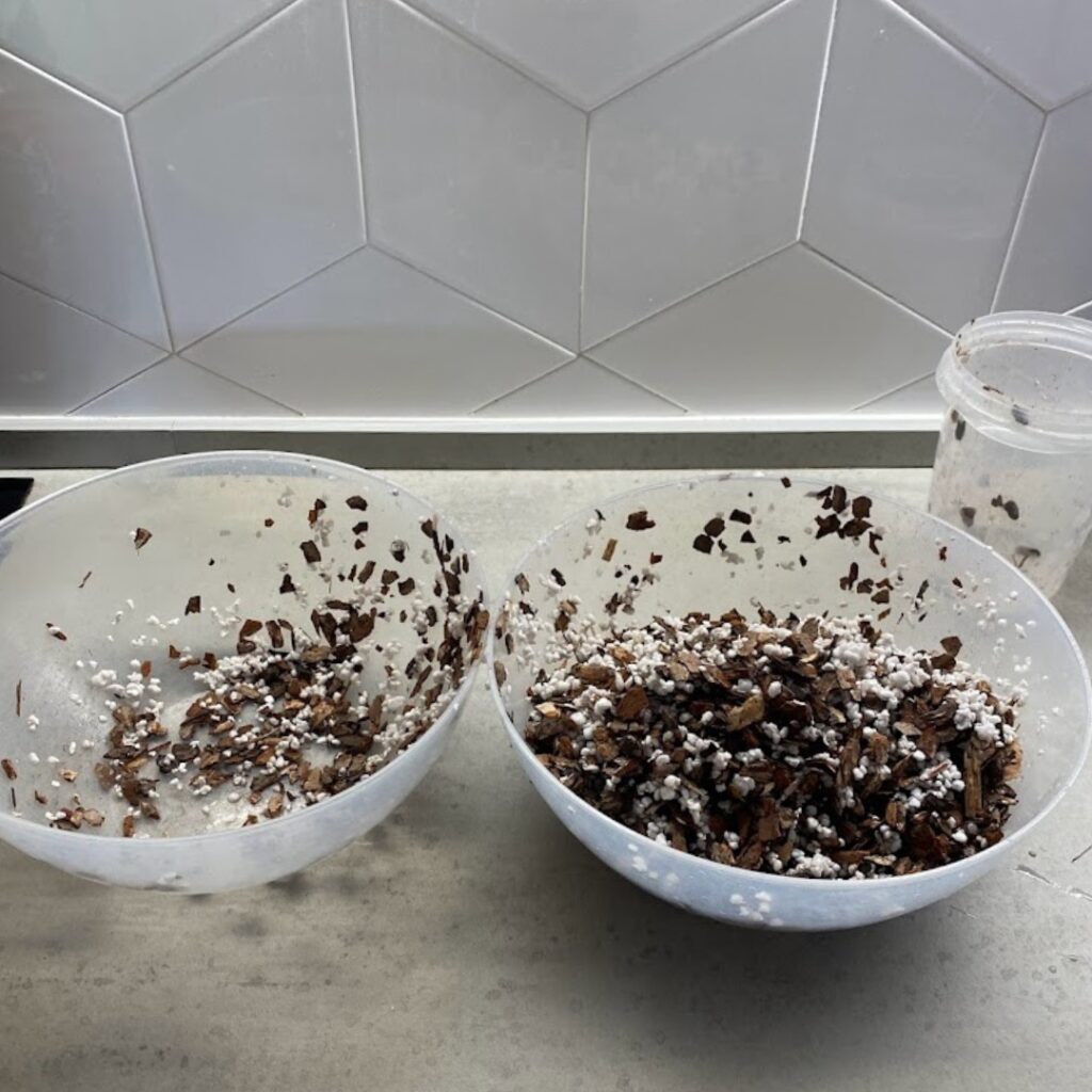 Mixing the soil between two bowls